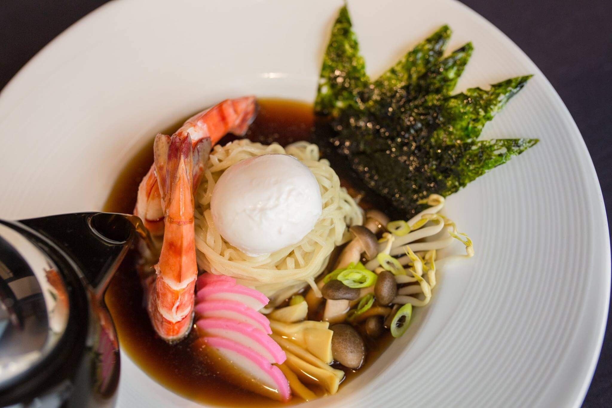 Beautiful ramen bowl with traditional garnishes and presentation